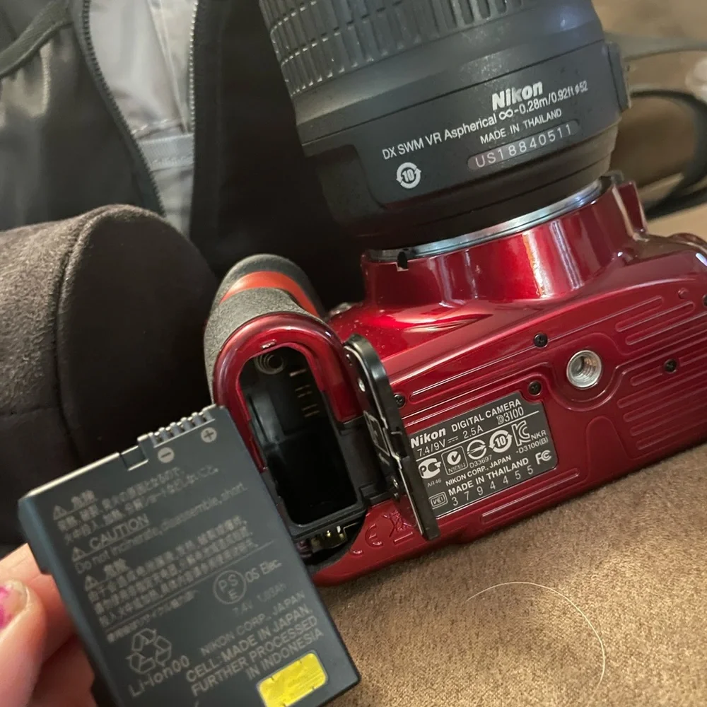 Nikon D3100 new camera has 2 batteries charger extra lens and carrying case